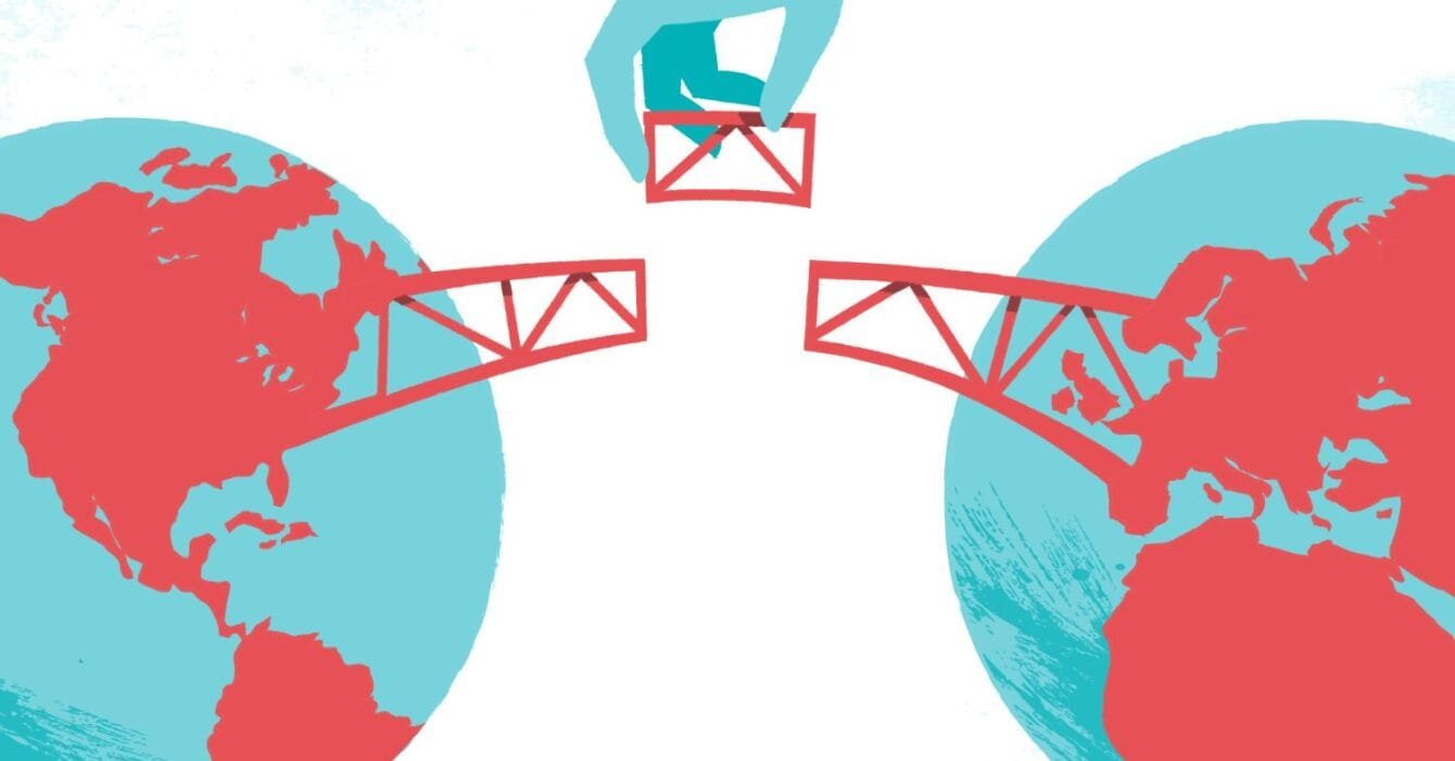 Asia M&A Cross-Border Digitization: A hand places a red bridge between two blue-globes, symbolizing connection across continents.